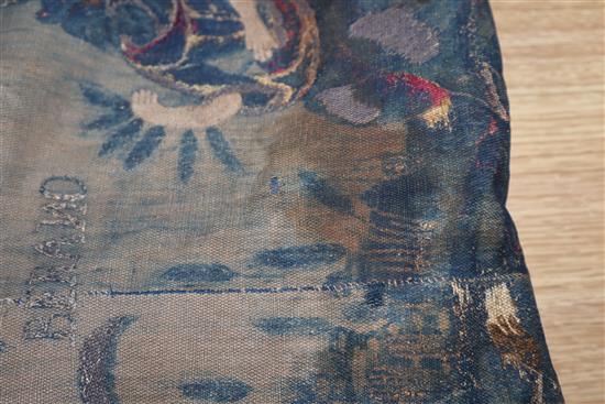 A blue brocade figurative hanging with metal thread embroidery and velvet border